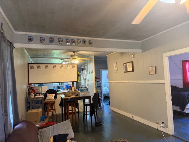 dining area featuring ceiling fan, dark wood-type flooring, and ornamental molding