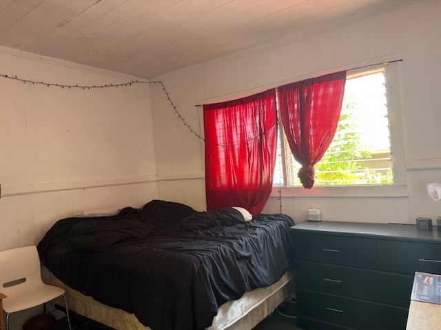 bedroom featuring crown molding and wooden ceiling