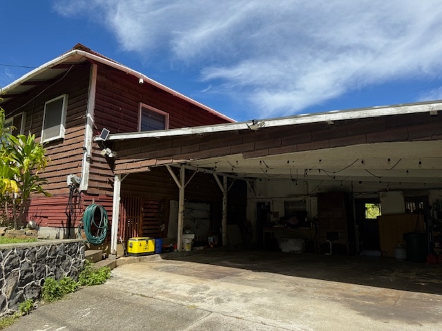 exterior space featuring a carport