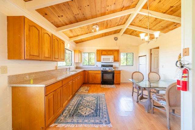 kitchen with gas stove, sink, a notable chandelier, light hardwood / wood-style floors, and decorative light fixtures