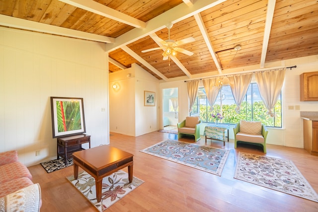 living room featuring light wood-type flooring, vaulted ceiling with beams, ceiling fan, and wooden ceiling