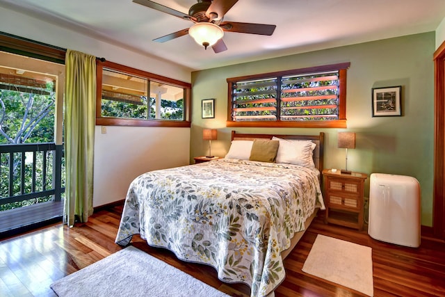 bedroom with access to exterior, hardwood / wood-style flooring, and ceiling fan