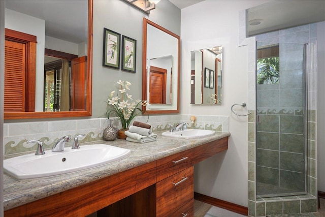 bathroom featuring vanity and a shower with shower door