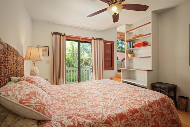 bedroom with ceiling fan, wood-type flooring, and access to outside