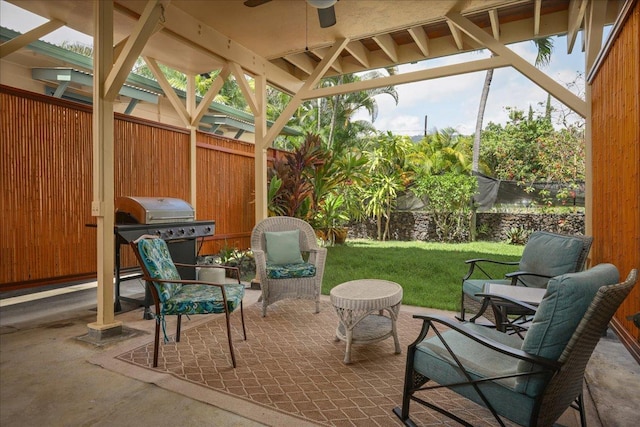 view of patio / terrace with a gazebo, ceiling fan, and a grill