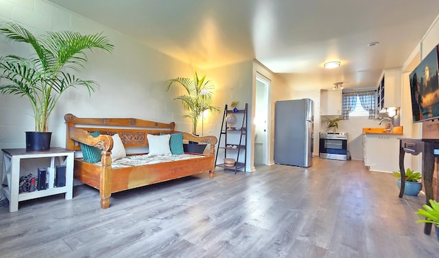 interior space with hardwood / wood-style flooring and sink