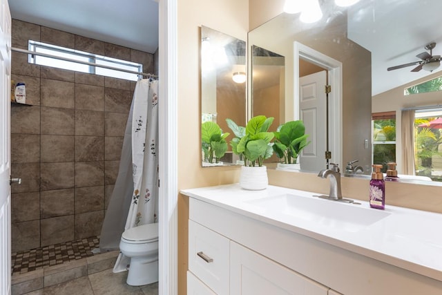 bathroom with tile patterned flooring, vanity, ceiling fan, toilet, and a shower with shower curtain