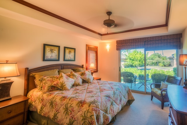 bedroom with carpet, access to outside, ceiling fan, and a tray ceiling