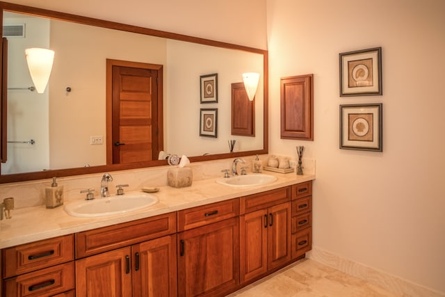 bathroom with tile patterned flooring and vanity