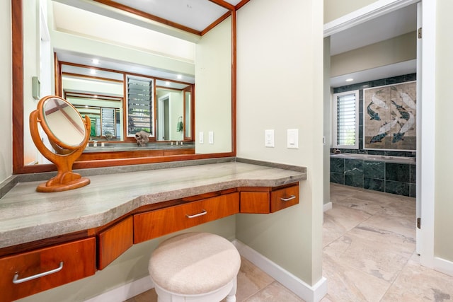 bathroom featuring vanity and a tub to relax in