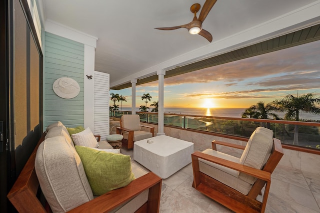 sunroom featuring ceiling fan