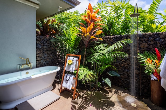 bathroom featuring a washtub