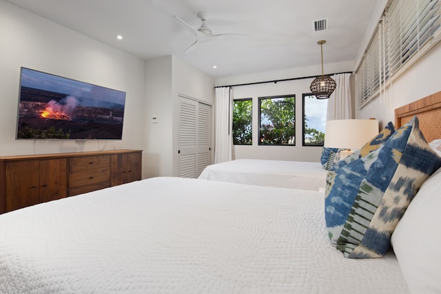 bedroom featuring a closet and ceiling fan