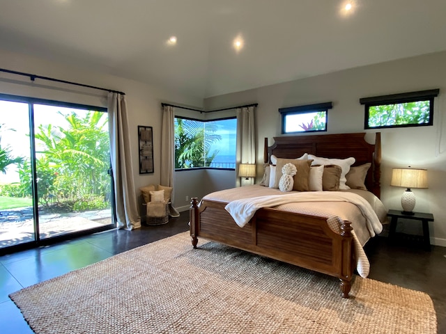 bedroom with access to exterior, multiple windows, and lofted ceiling