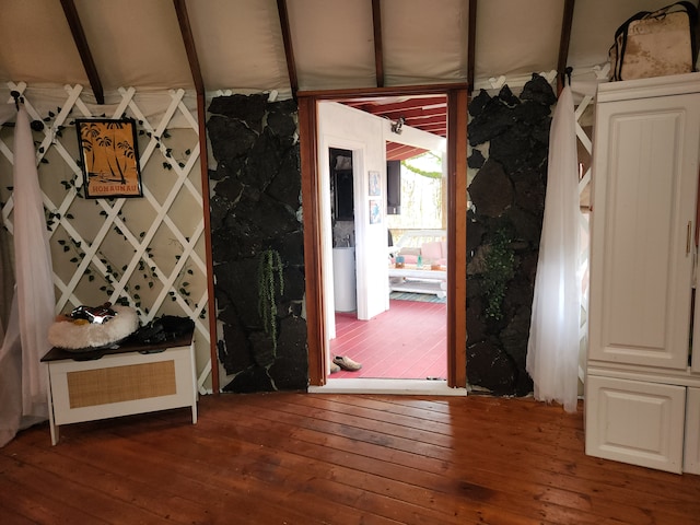 hall with beam ceiling and hardwood / wood-style flooring