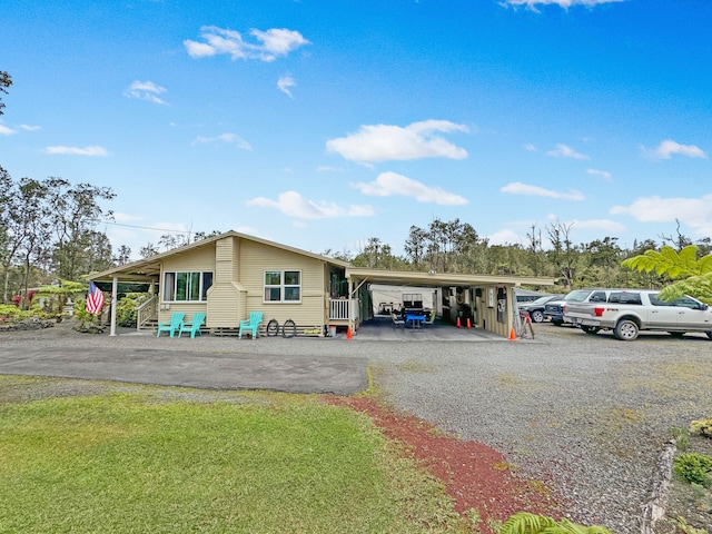 view of front of home with a carport