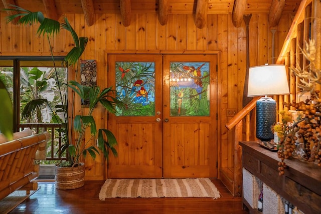 entrance foyer with hardwood / wood-style flooring, plenty of natural light, and beamed ceiling