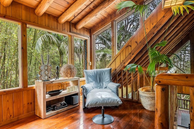 sunroom / solarium with lofted ceiling with beams and wood ceiling