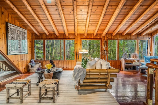 sunroom featuring beamed ceiling and wood ceiling