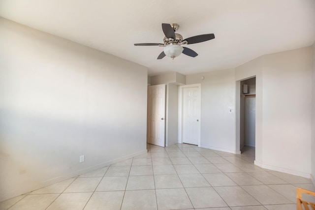 unfurnished bedroom featuring ceiling fan and light tile patterned floors