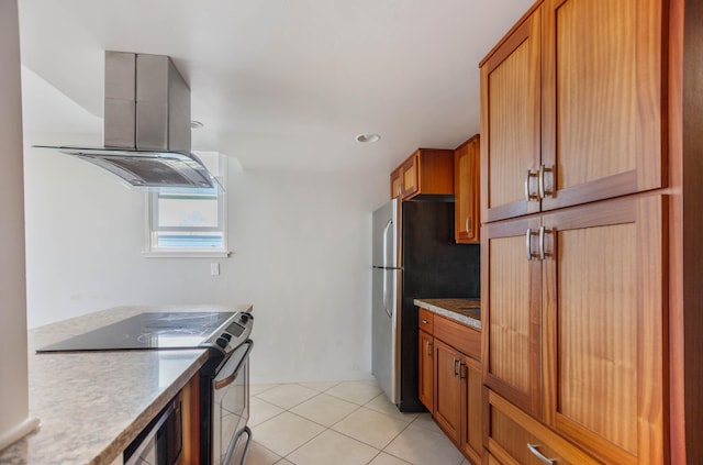 kitchen featuring light tile patterned floors, island exhaust hood, and appliances with stainless steel finishes