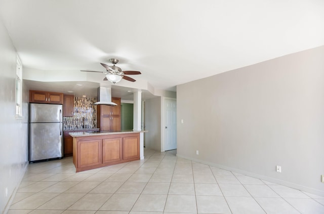 kitchen with extractor fan, black cooktop, stainless steel refrigerator, ceiling fan, and backsplash