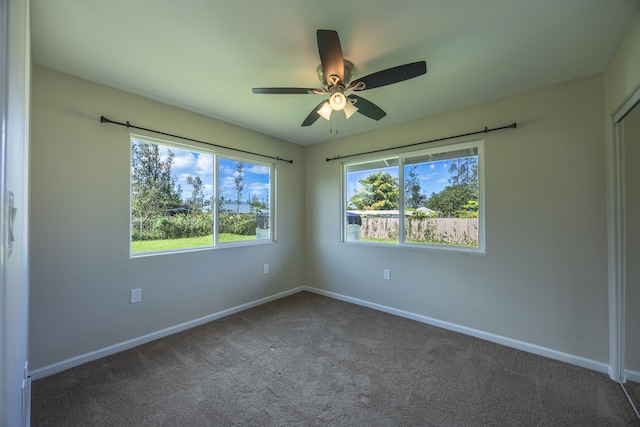 carpeted empty room with ceiling fan