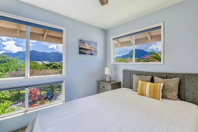 bedroom featuring a mountain view