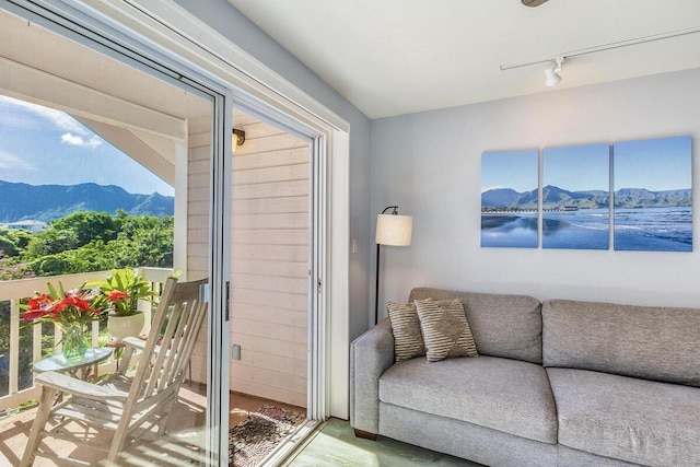 living room with a mountain view and track lighting