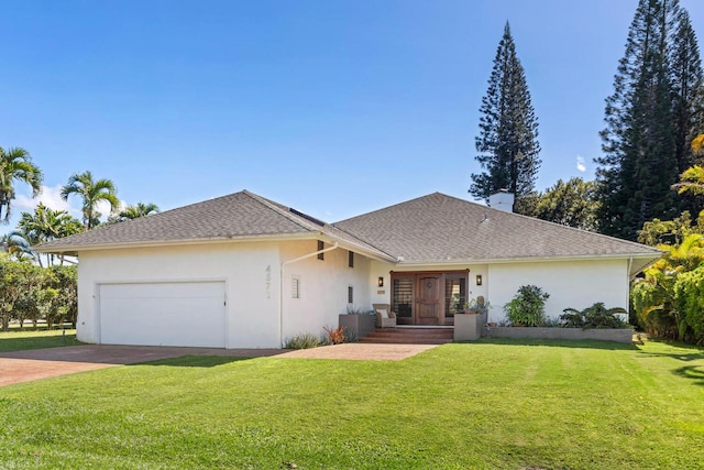 single story home with a garage and a front lawn