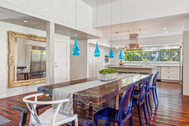 dining space featuring dark wood-type flooring