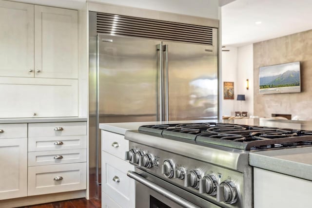 kitchen with premium appliances and white cabinetry