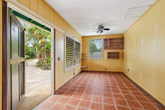 interior space with carpet and ceiling fan