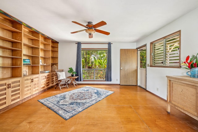 living area with hardwood / wood-style flooring and ceiling fan