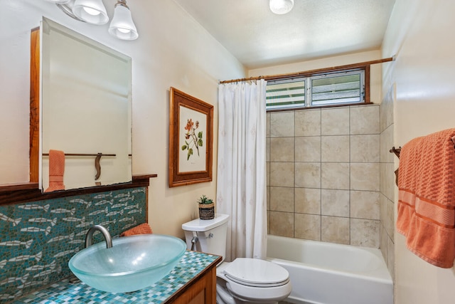 full bathroom with shower / tub combo with curtain, vanity, and toilet