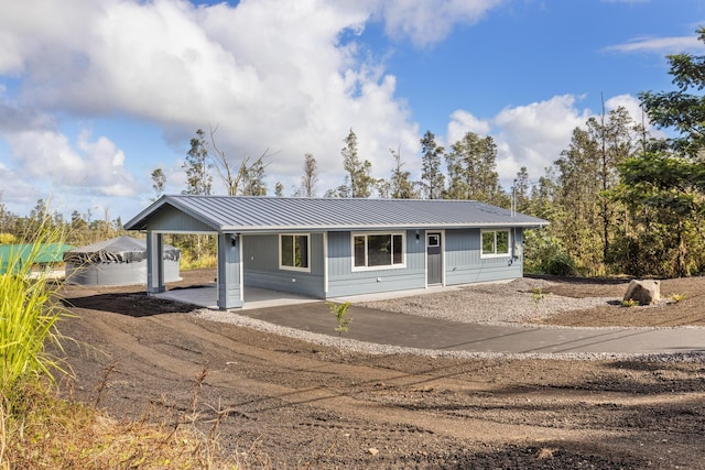 single story home featuring a carport