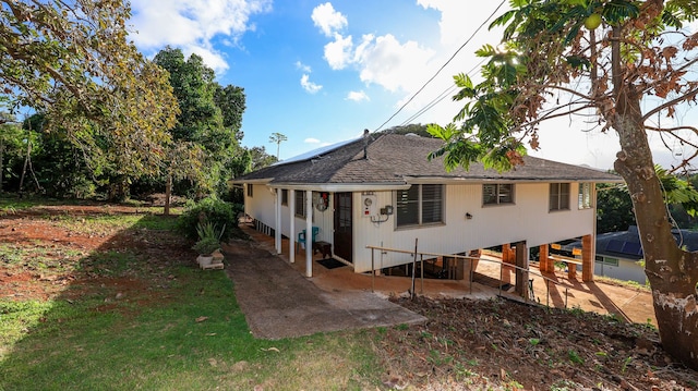 back of property with a patio area