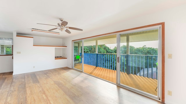 empty room featuring ceiling fan and light hardwood / wood-style flooring