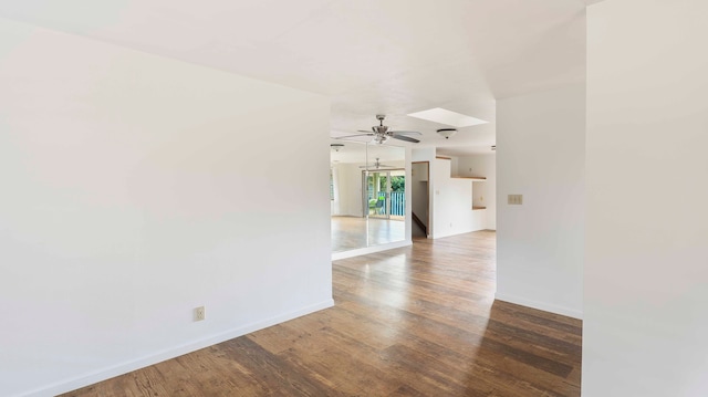 empty room featuring ceiling fan and dark hardwood / wood-style floors