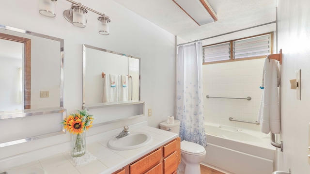 full bathroom featuring toilet, a textured ceiling, vanity, and shower / tub combo with curtain