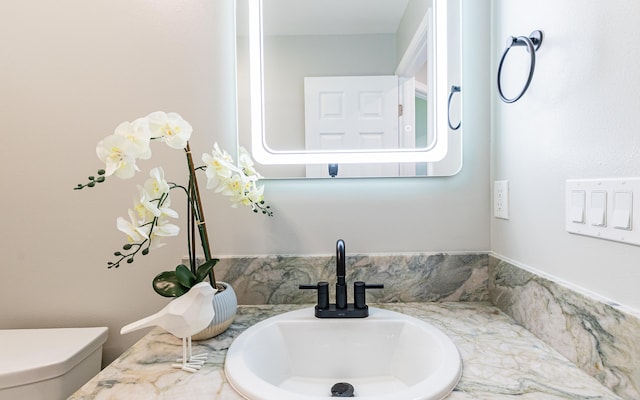 bathroom with toilet and sink