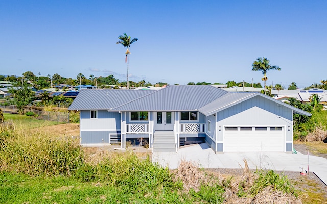 ranch-style house with covered porch and a garage