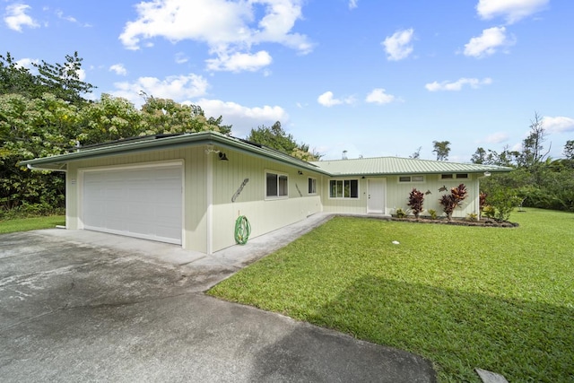 single story home with a garage and a front yard