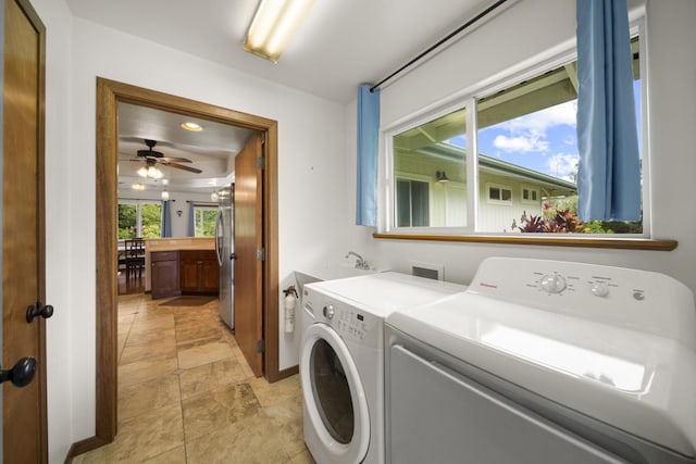 laundry room featuring washer and clothes dryer and ceiling fan