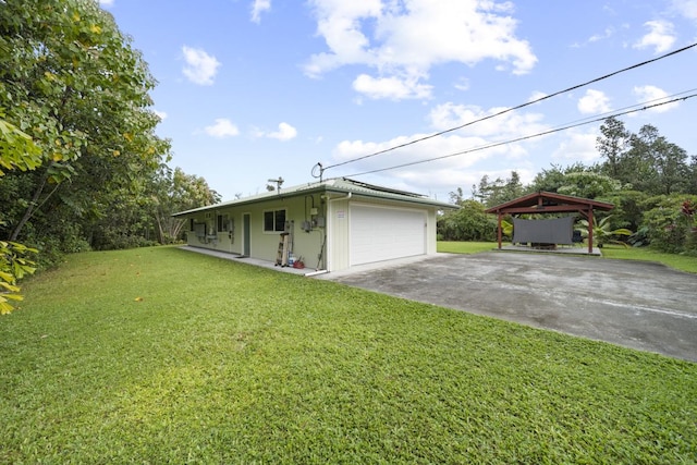 view of front of house with a front yard and a garage