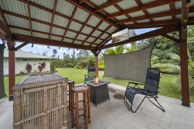 view of patio / terrace featuring a gazebo and a fire pit