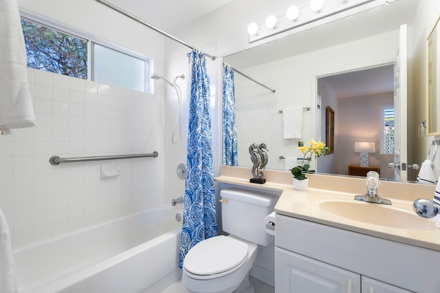 full bathroom with vanity, shower / bathtub combination with curtain, toilet, and plenty of natural light