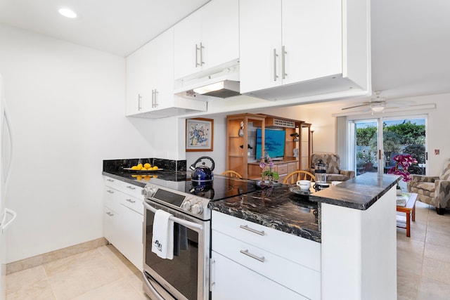 kitchen featuring stainless steel range with electric stovetop, ceiling fan, white cabinets, and kitchen peninsula