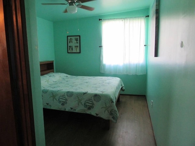 bedroom featuring ceiling fan and light wood-type flooring