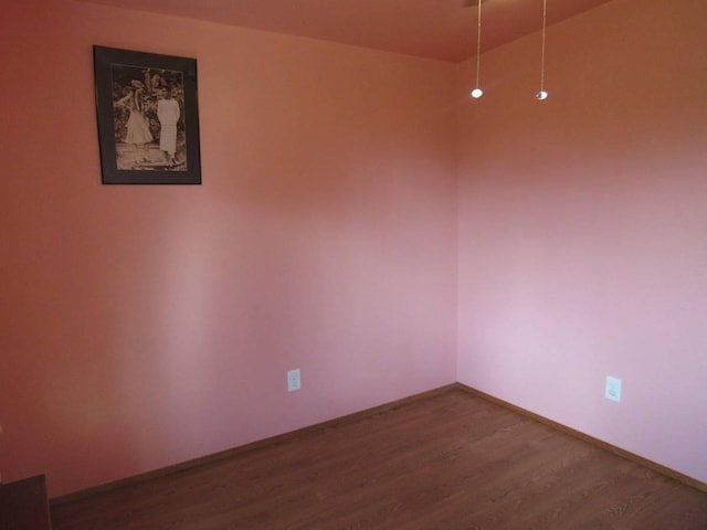 unfurnished room featuring hardwood / wood-style floors